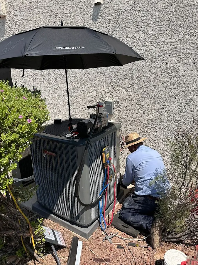 HVAC technician performing outdoor AC maintenance in Camp Pendleton South